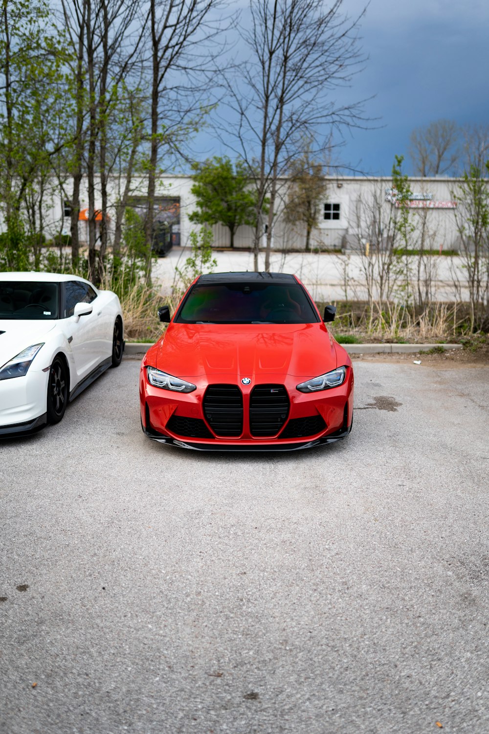 a red car parked in a parking lot