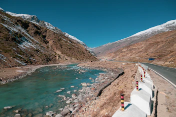 a road next to a body of water