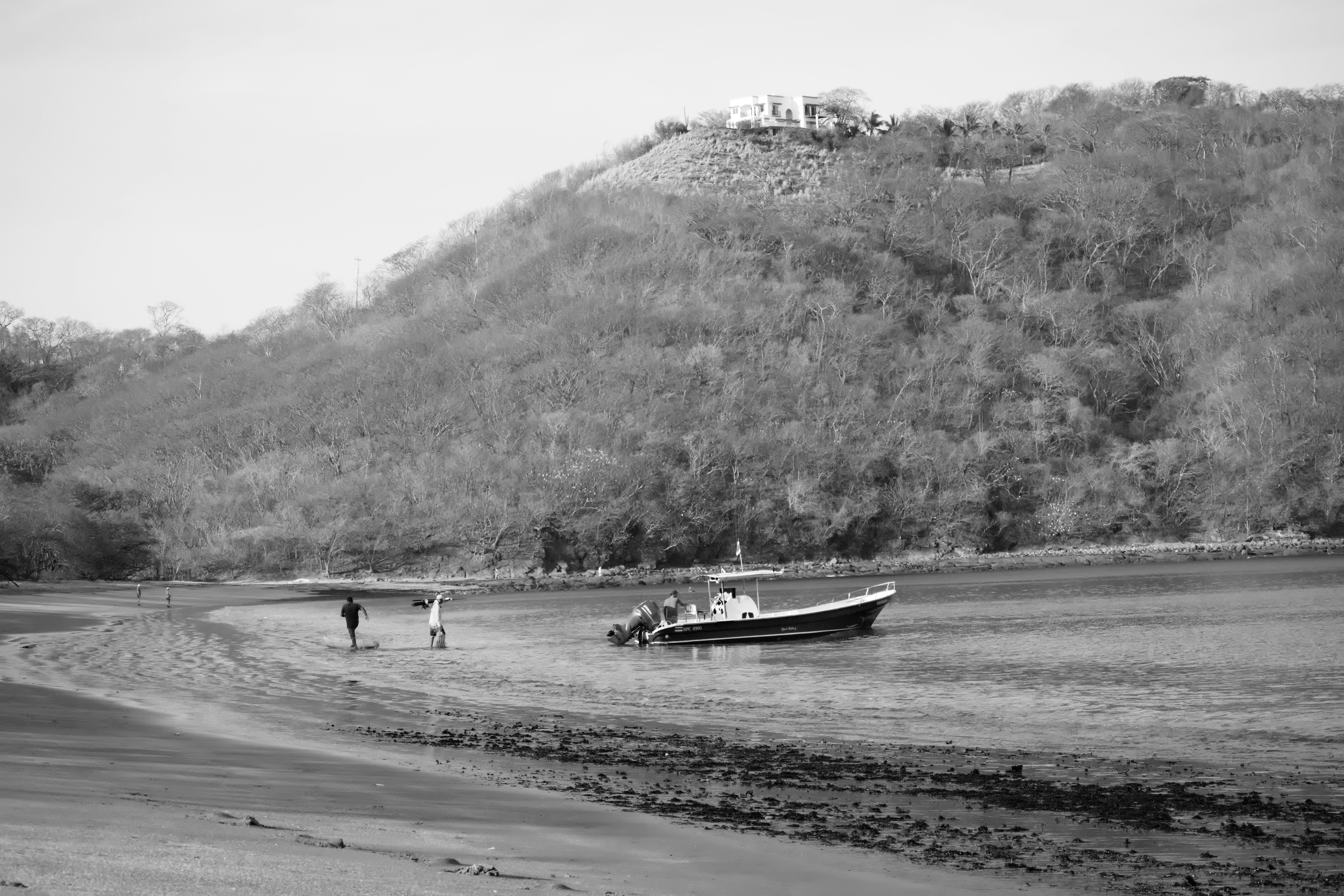 a boat is parked on the shore