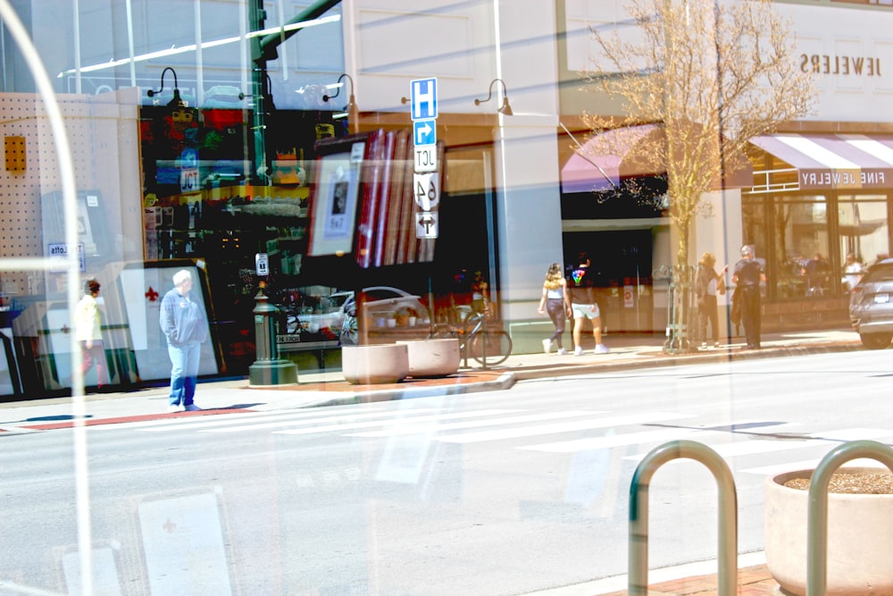 a street corner with people walking