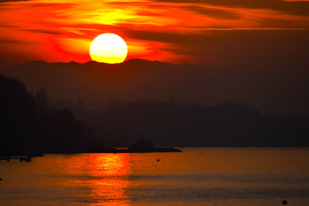 a sunset over a lake