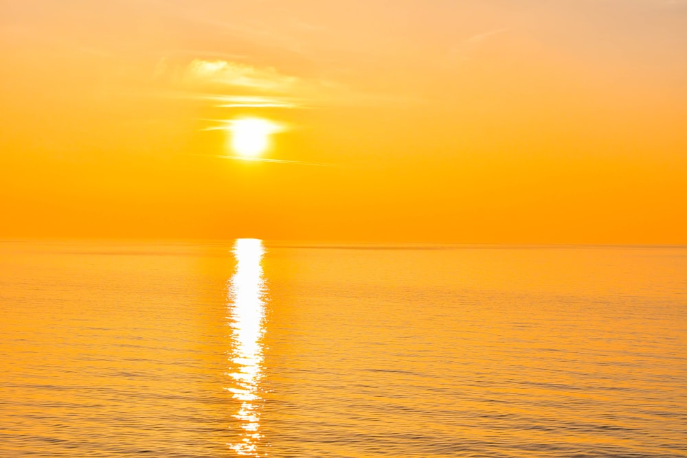 a sunset over a body of water