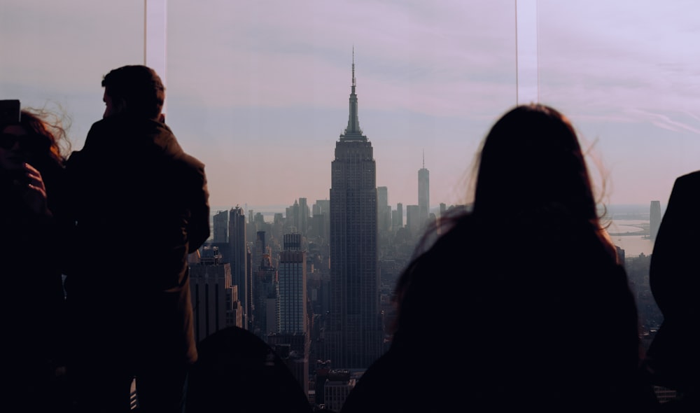 a group of people looking at a city skyline