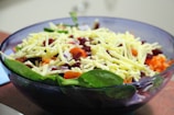 A colorful bowl of fresh mixed salad with various vegetables.