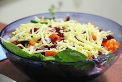 A colorful bowl of fresh mixed salad with various vegetables.