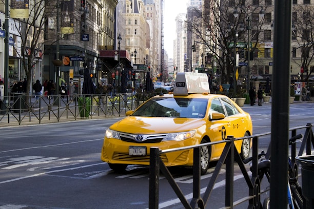 a yellow car on a street