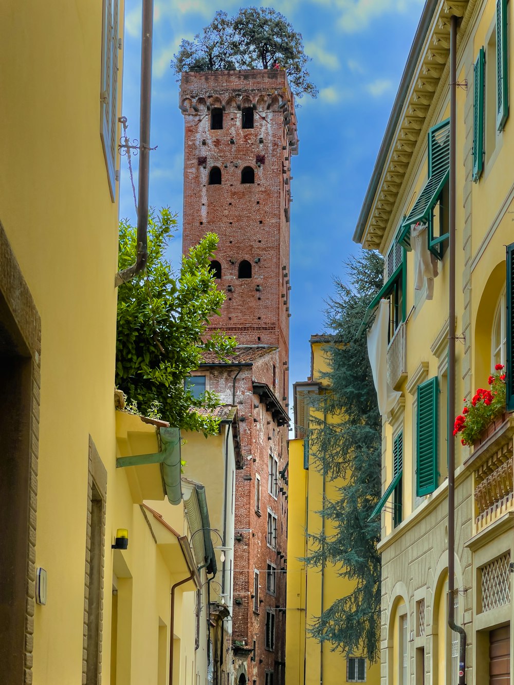 a tall brick tower in a city