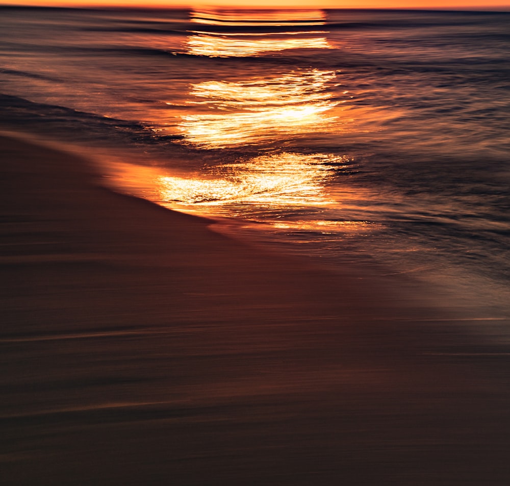 a sunset over a body of water