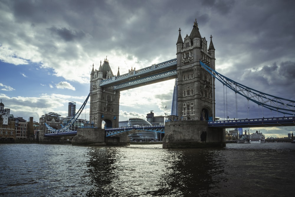 a bridge over water with a tower