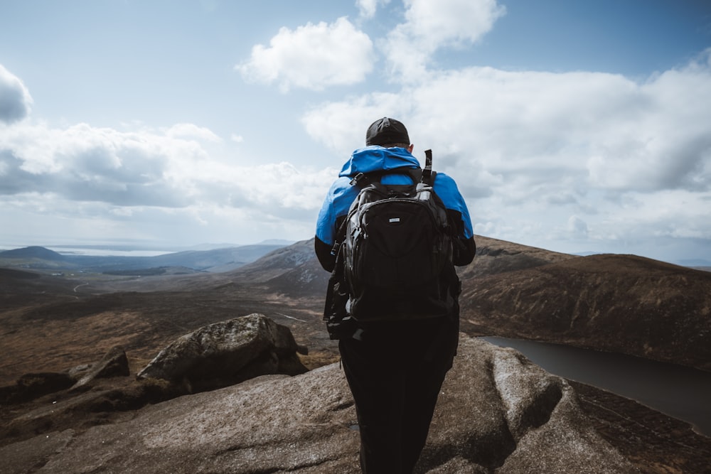a person with a backpack on a mountain