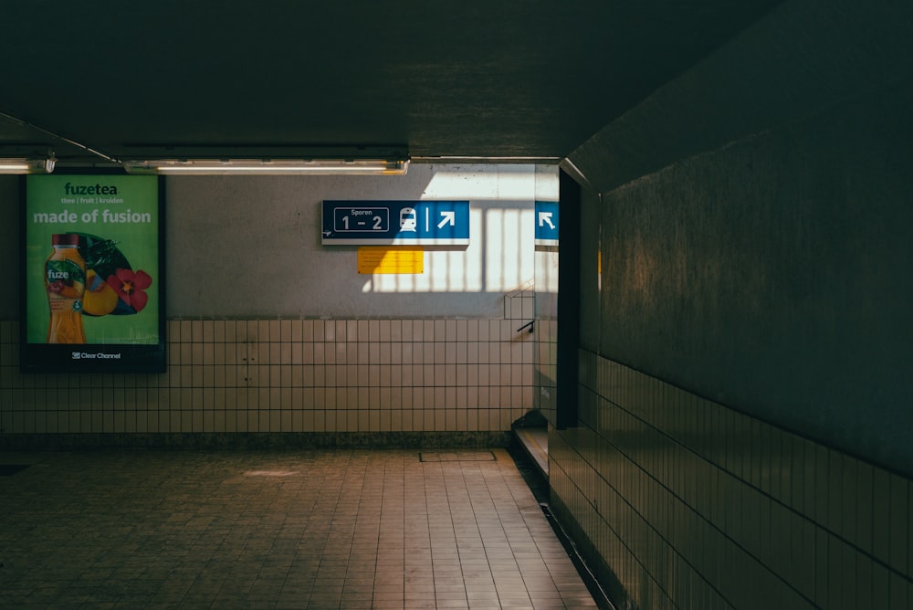 a hallway with signs on the wall