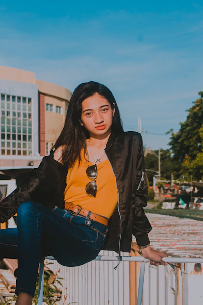 a person sitting on a railing