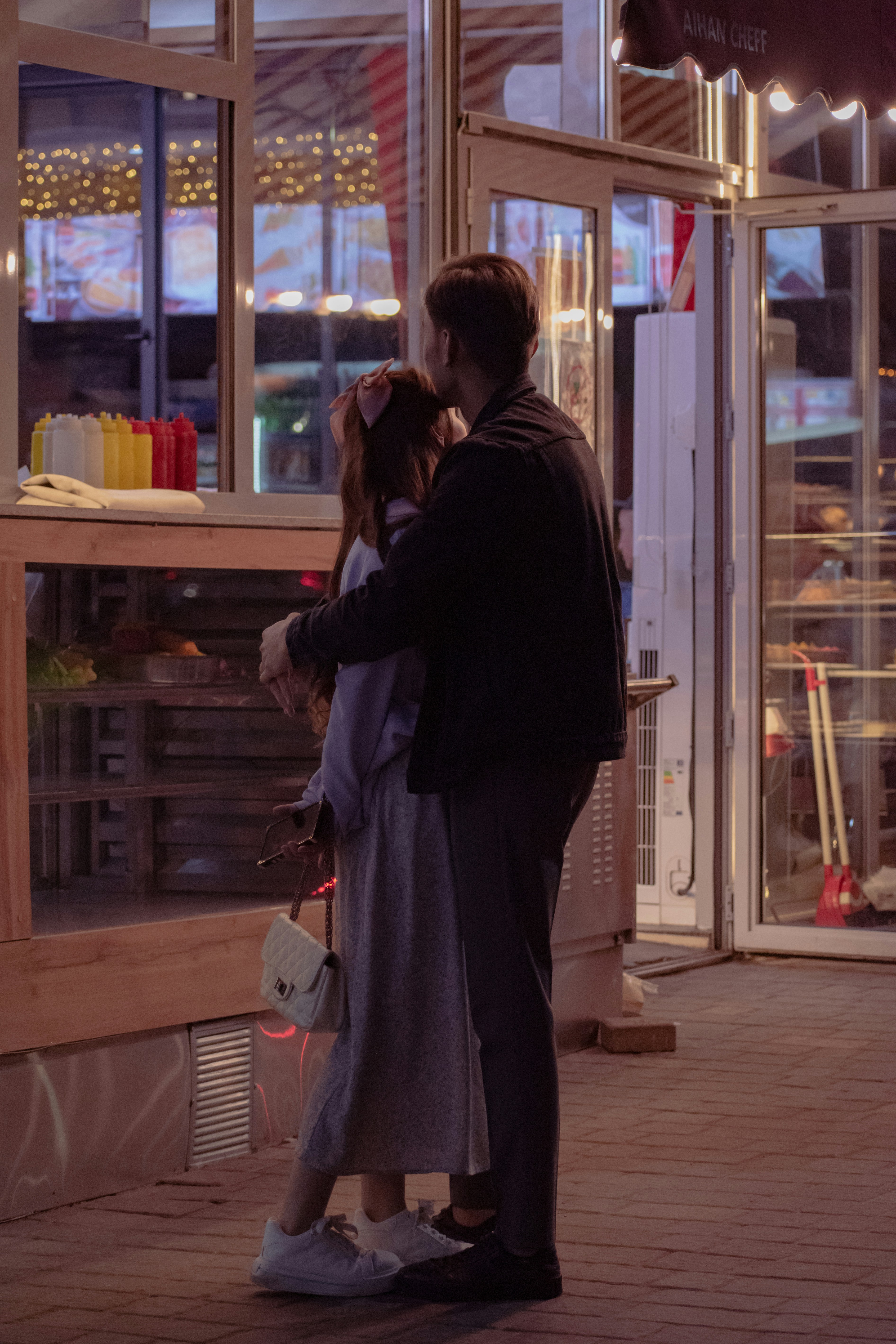 a man and woman kissing