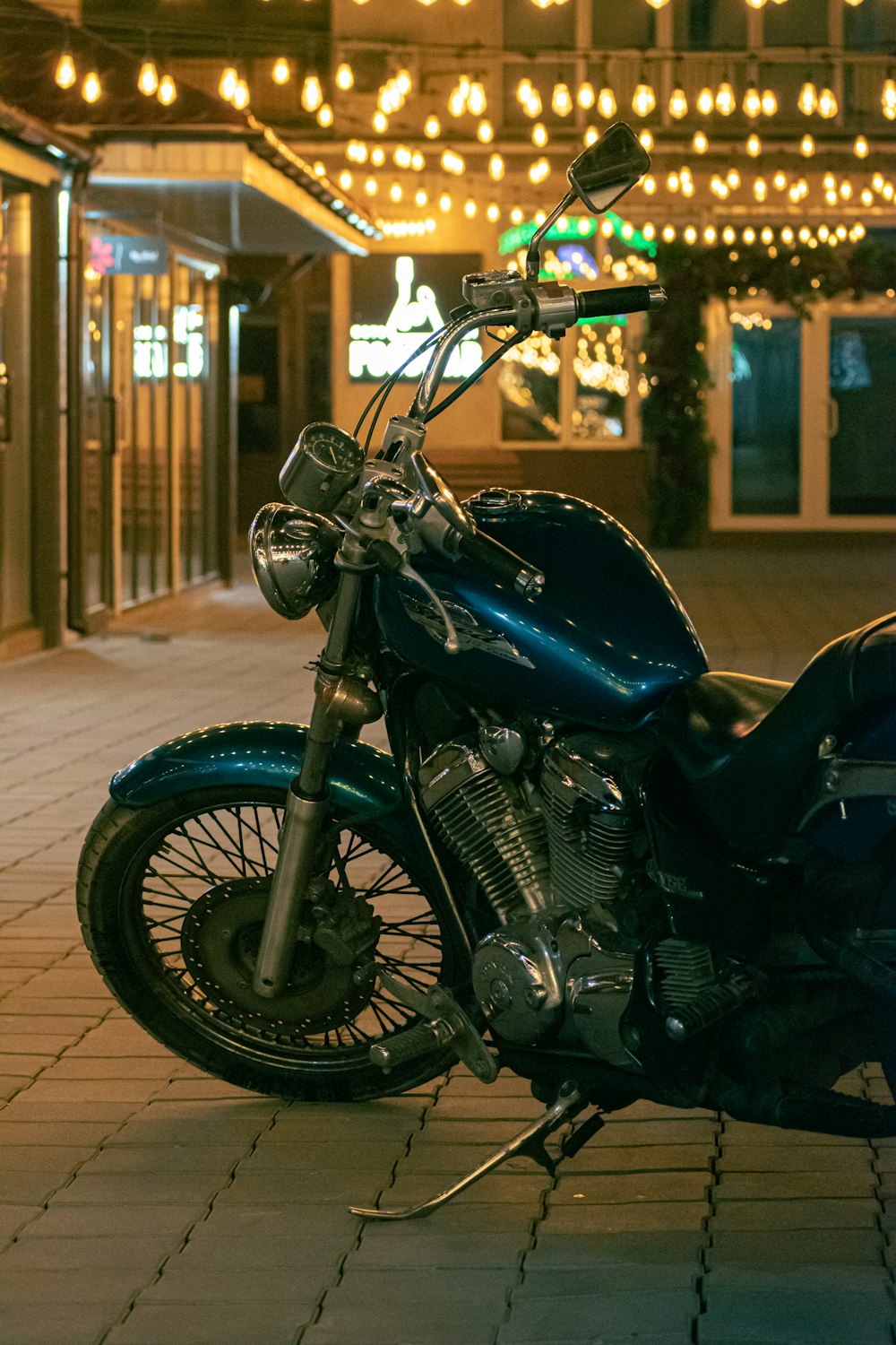 a motorcycle parked on a sidewalk