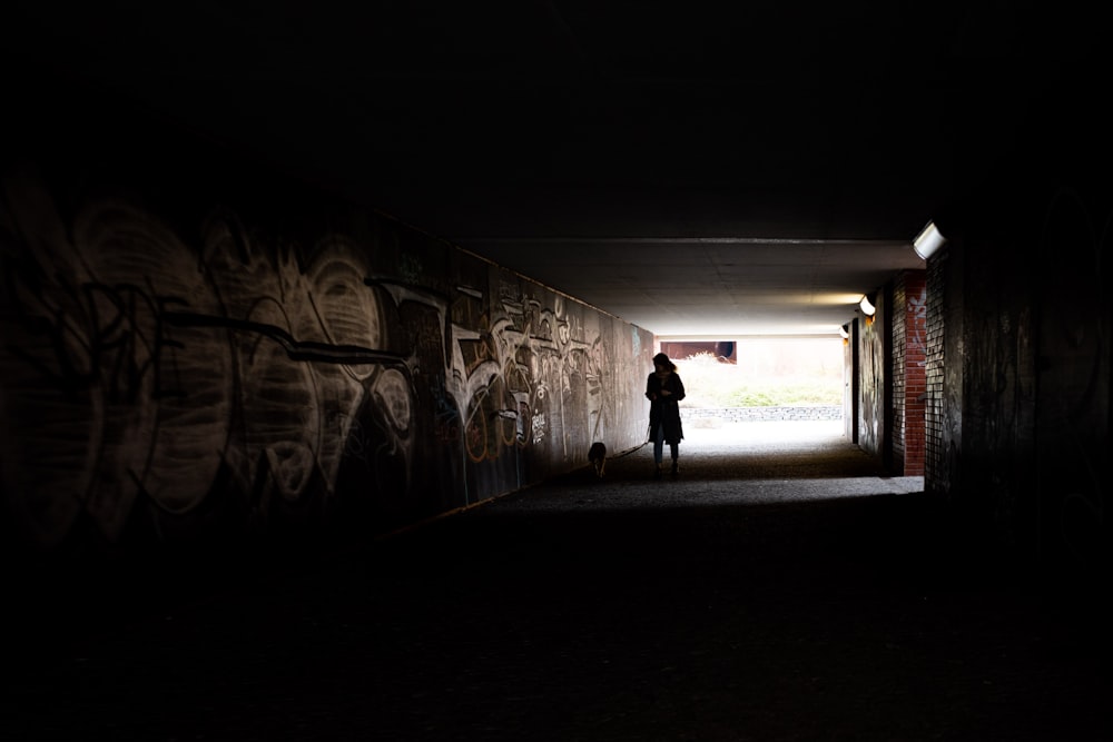 a person walking in a dark room