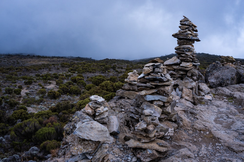a rocky area with a stack of rocks on it