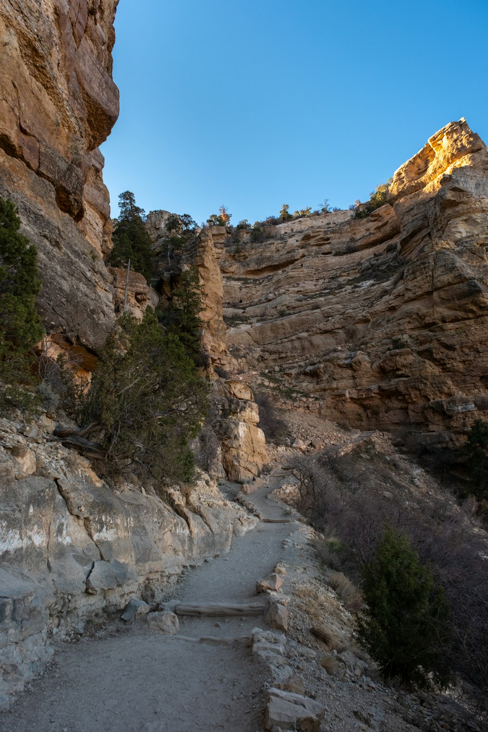 a rocky canyon with a river running through it