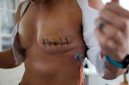 a close-up of a woman's chest with a tattoo on it