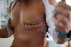 a close-up of a woman's chest with a tattoo on it