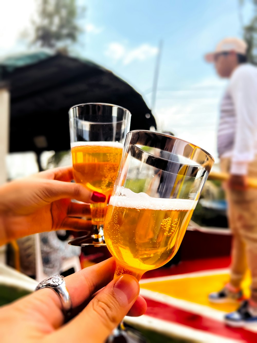 a couple of people holding glasses of beer