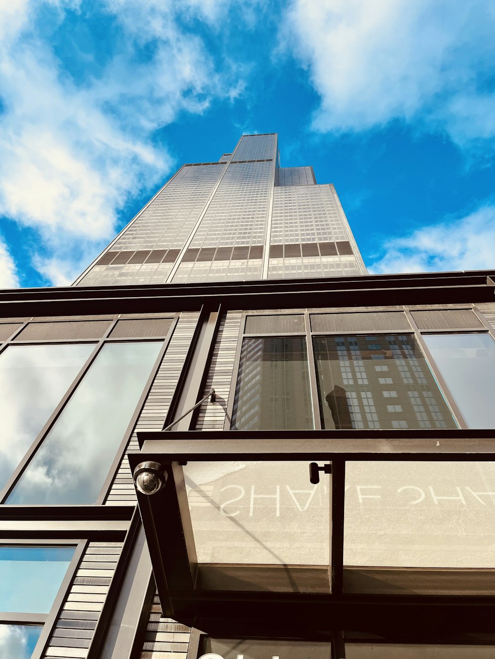 a tall building with glass windows