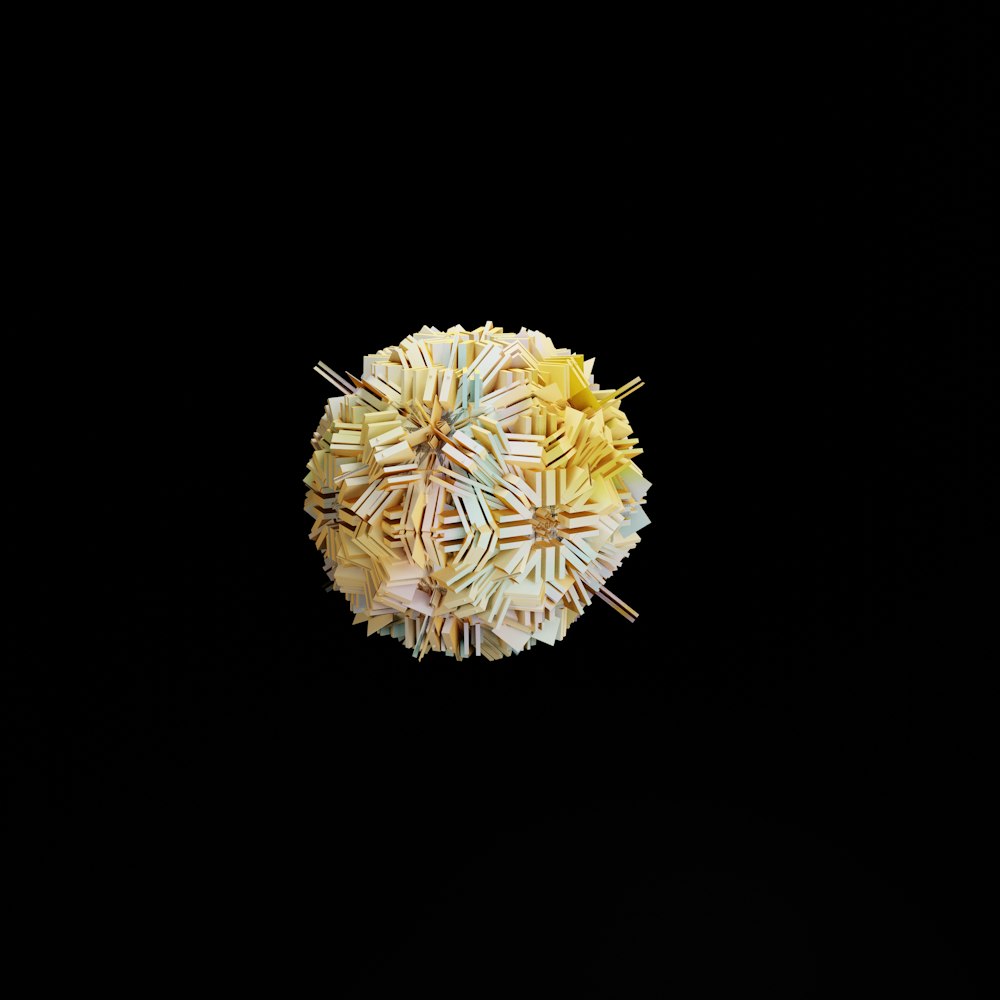 a yellow flower on a black background