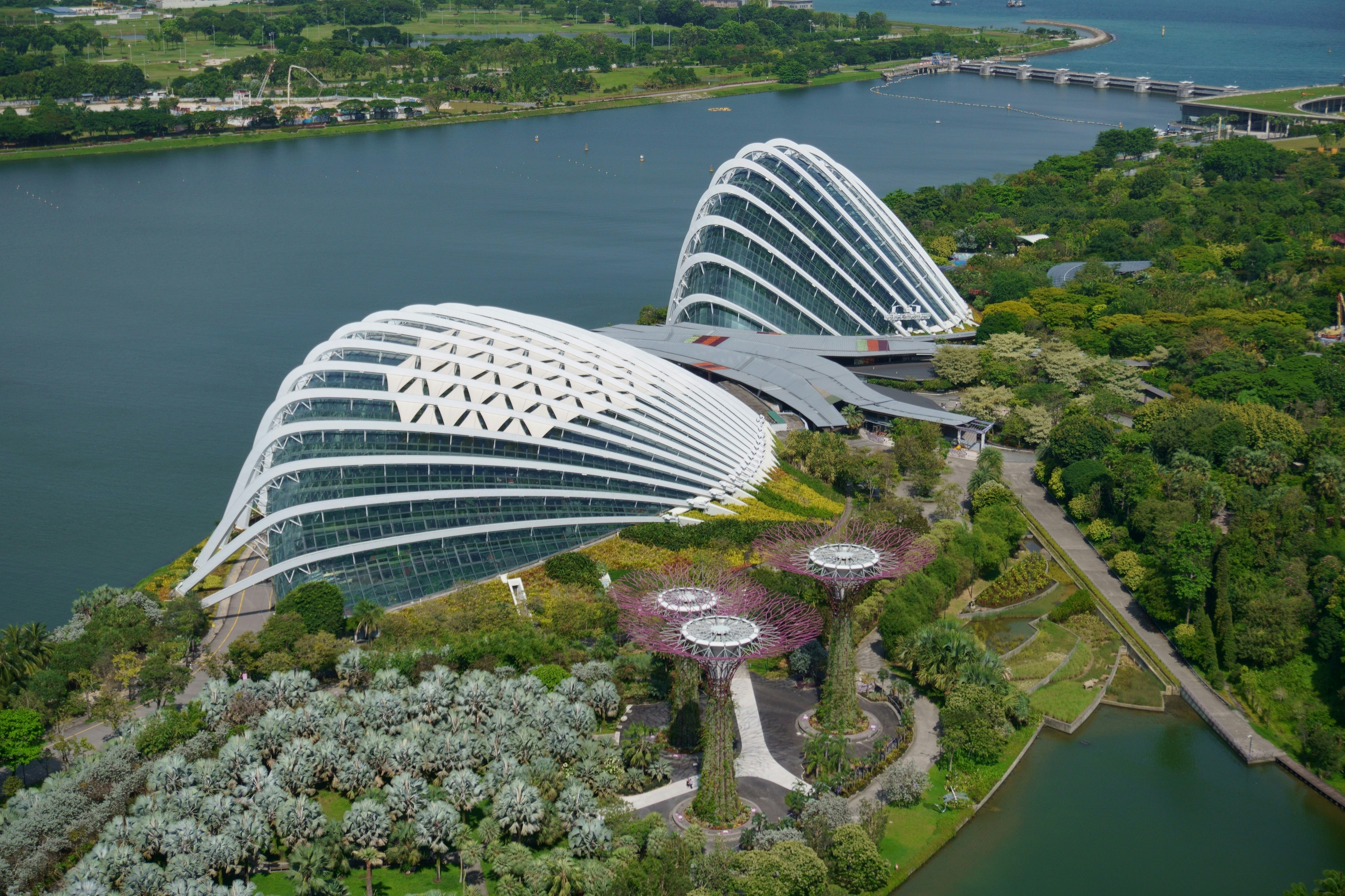 a large building with a pool in front of it