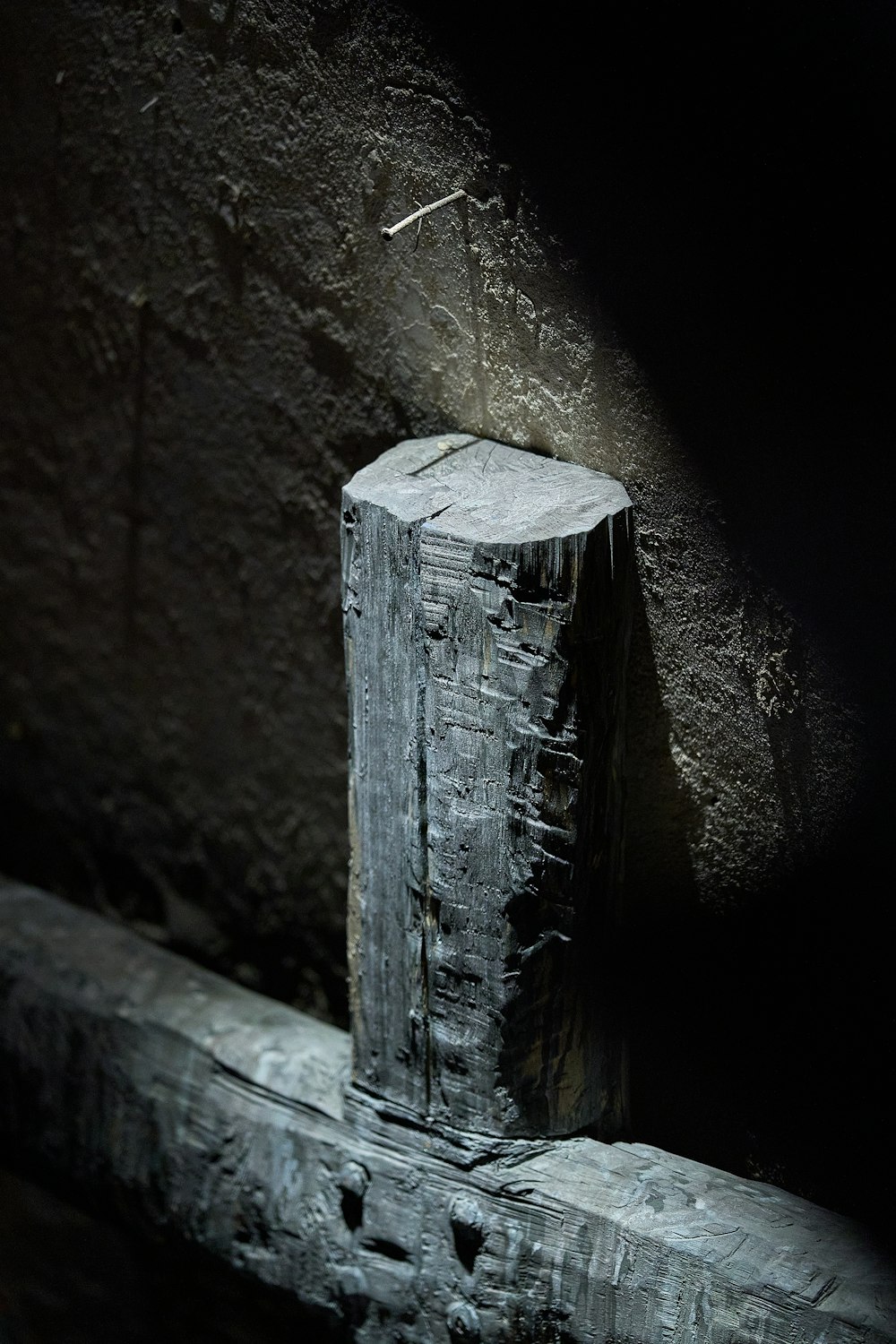 a stone pillar in a dark room