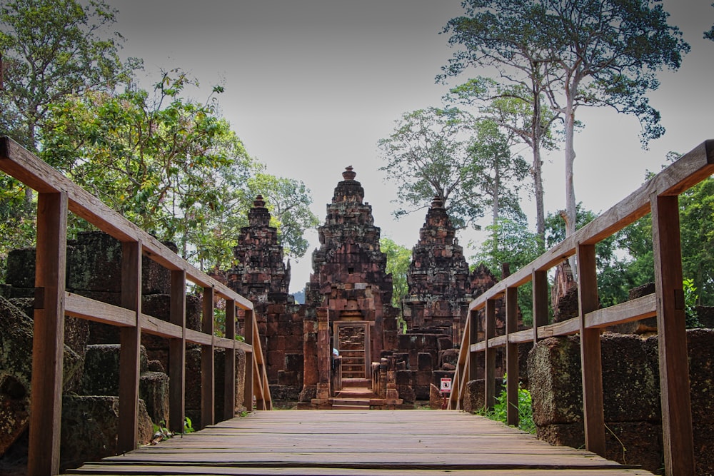 a wooden walkway leading to a building