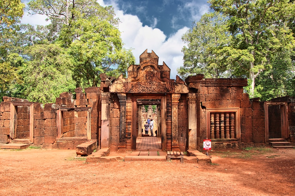 Banteay Srei with a few people standing in the doorway