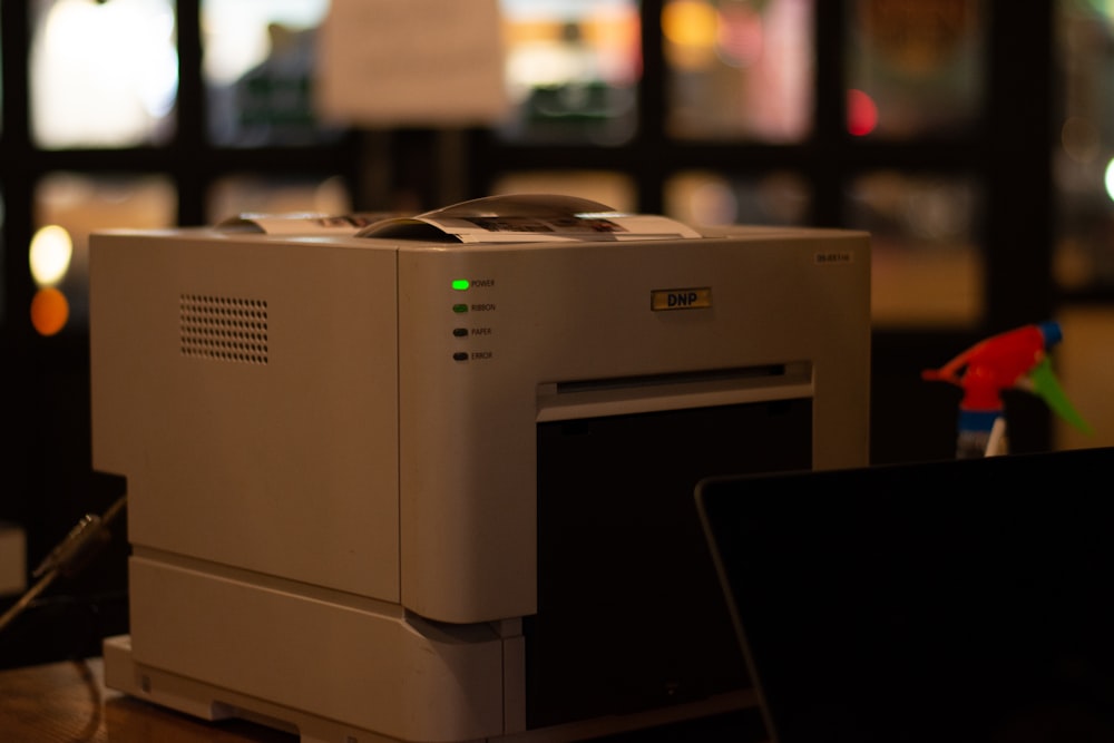 a white printer on a table