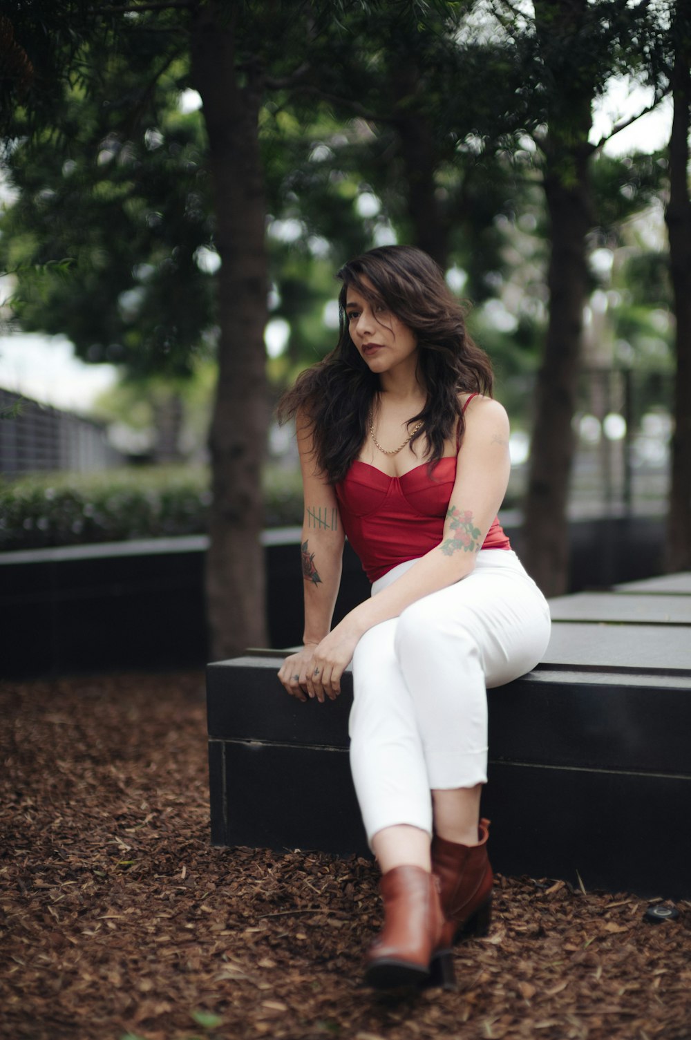 a woman sitting on a suitcase