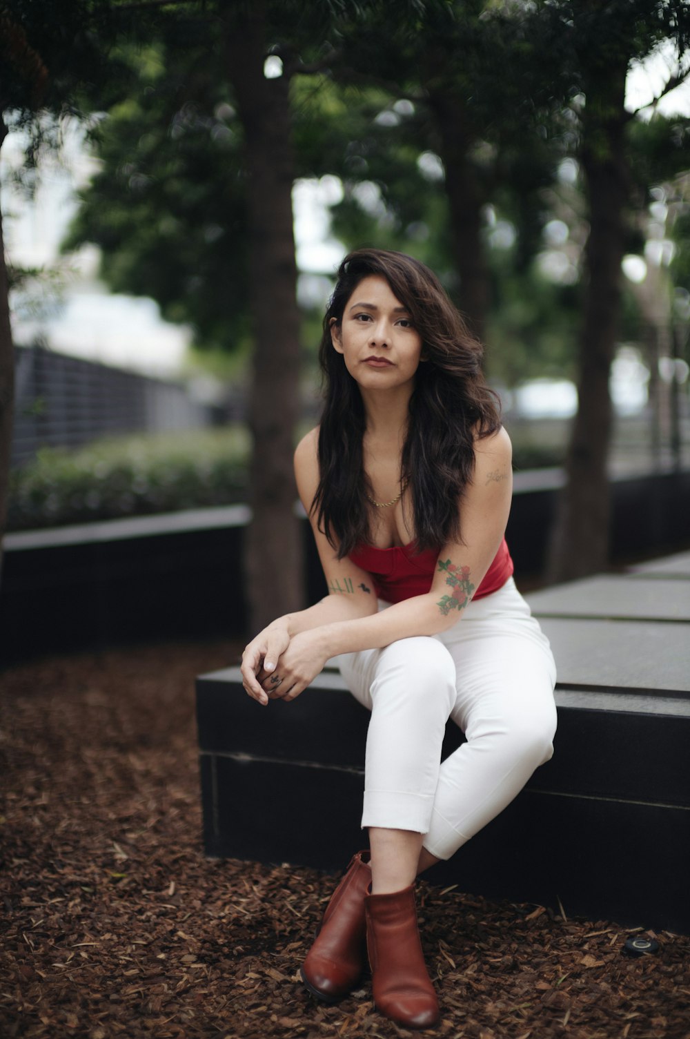 a woman sitting on a bench