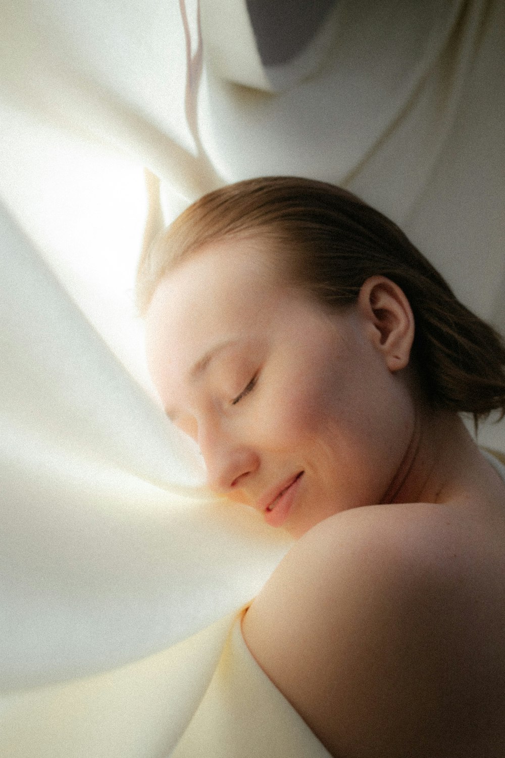 a person lying in a bathtub