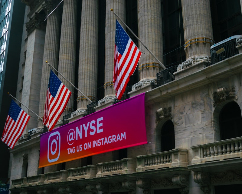 The New York Stock Exchange building with American flags