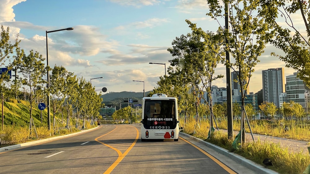 a bus driving down a street