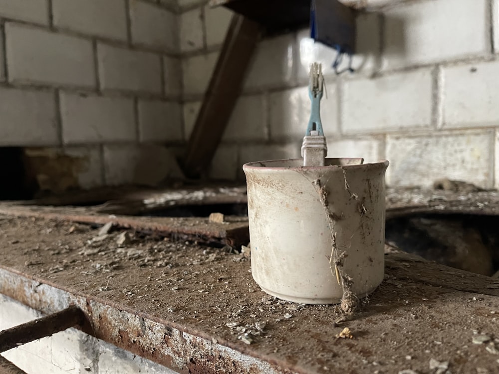 a dirty bathroom with a broken toilet