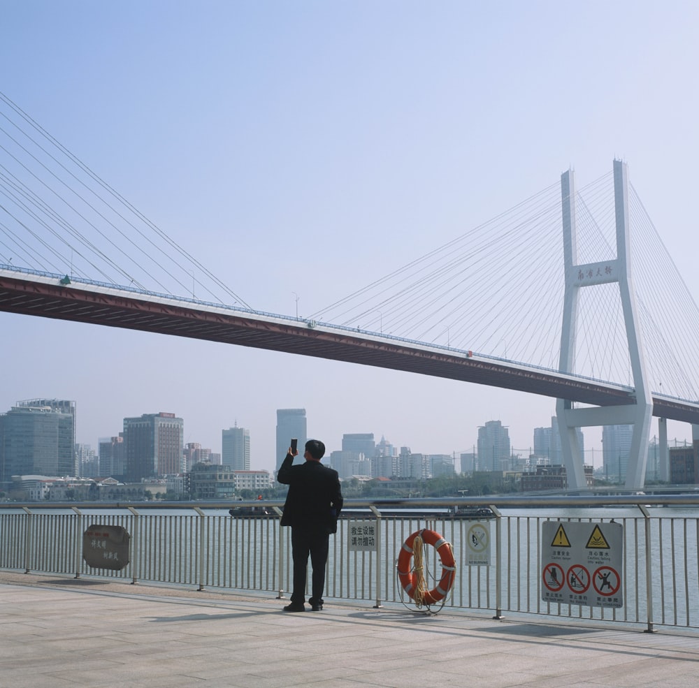 a person standing on a bridge