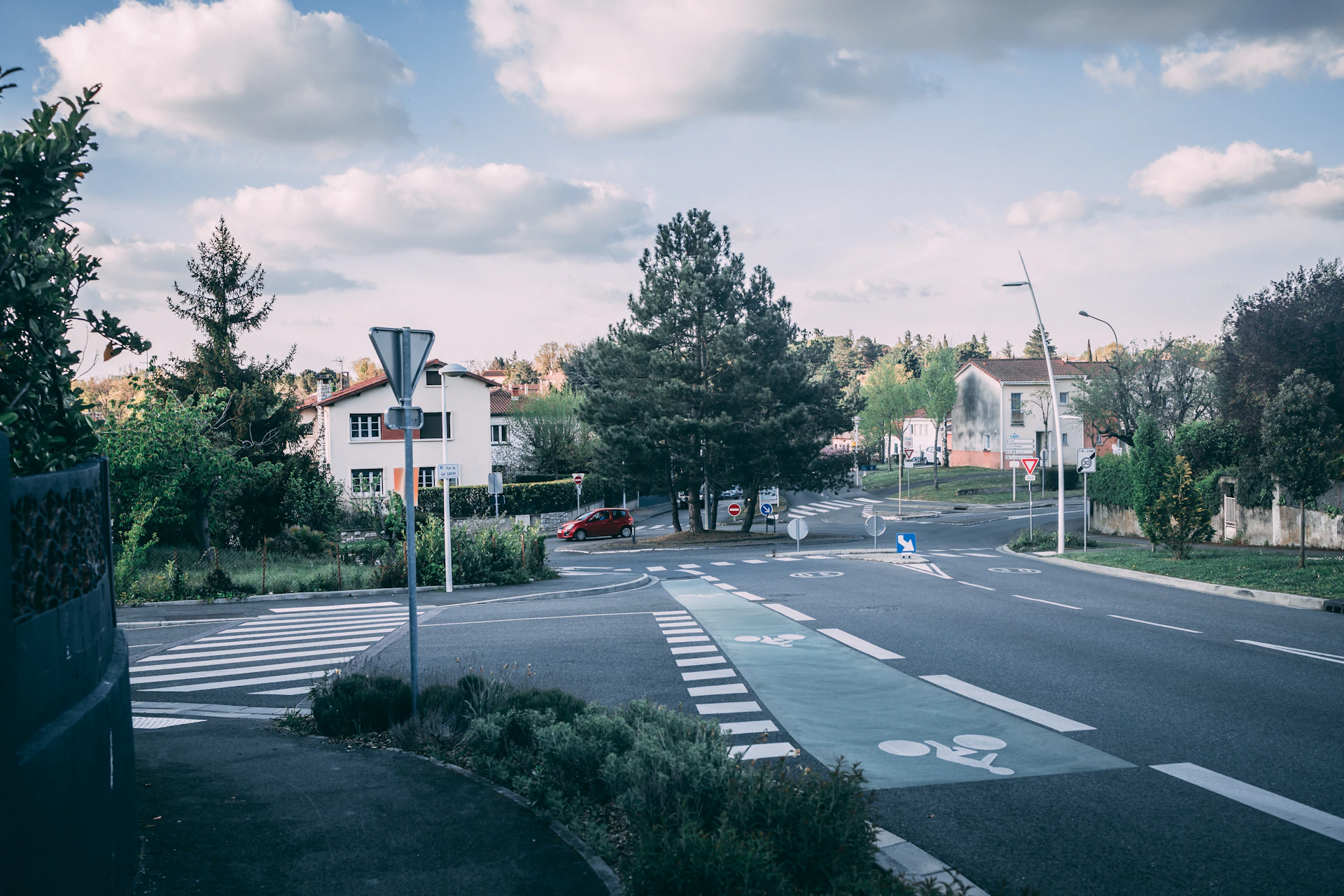 woman wearing yellow long-sleeved dress under white clouds and blue sky during daytime