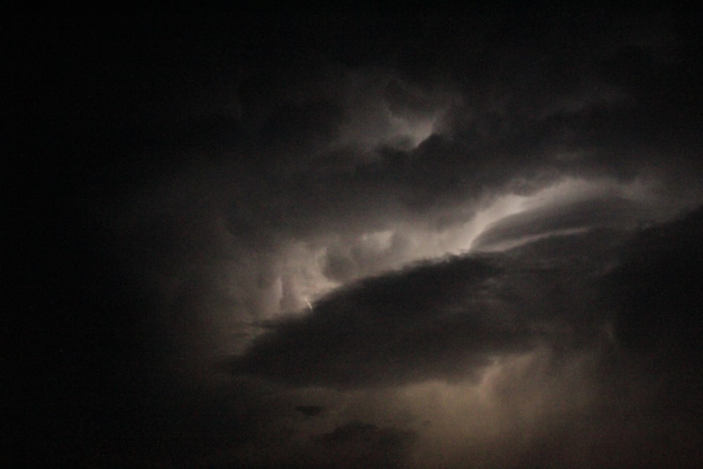 a dark sky with clouds