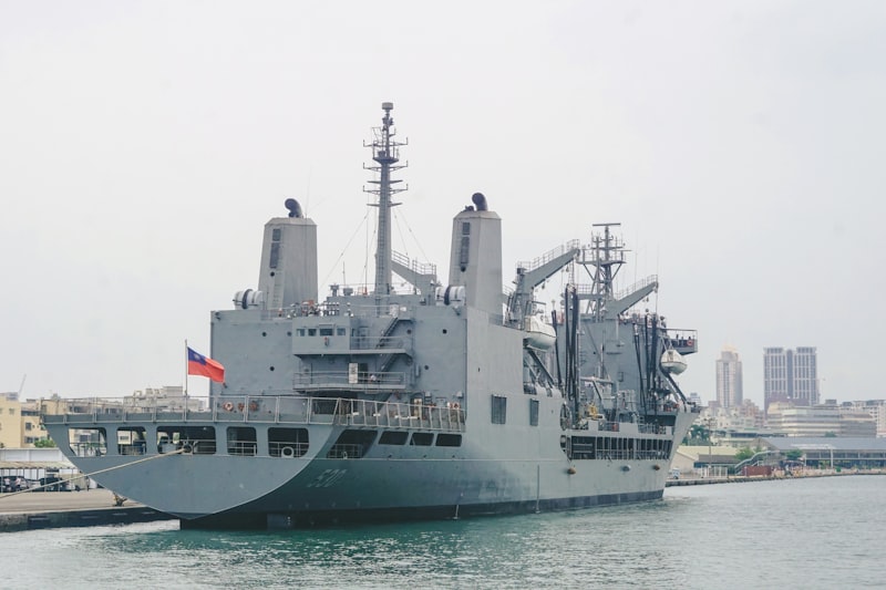 A large military cargo ship docked in port