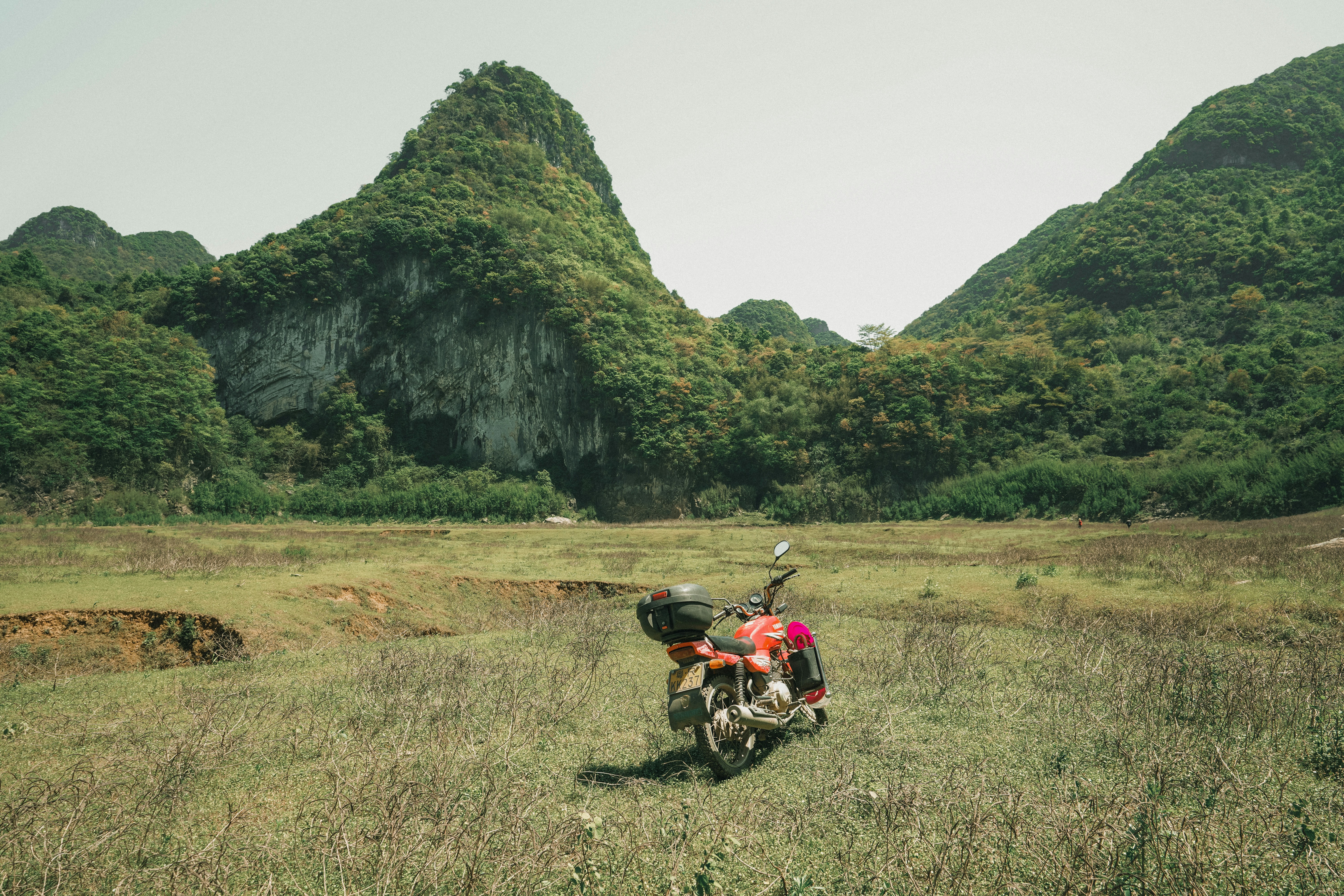 a motorcycle parked in a field
