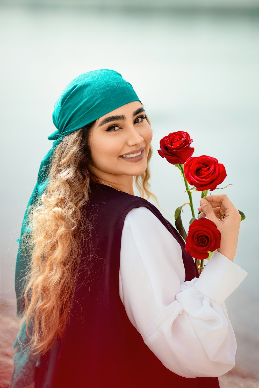 a woman holding a rose