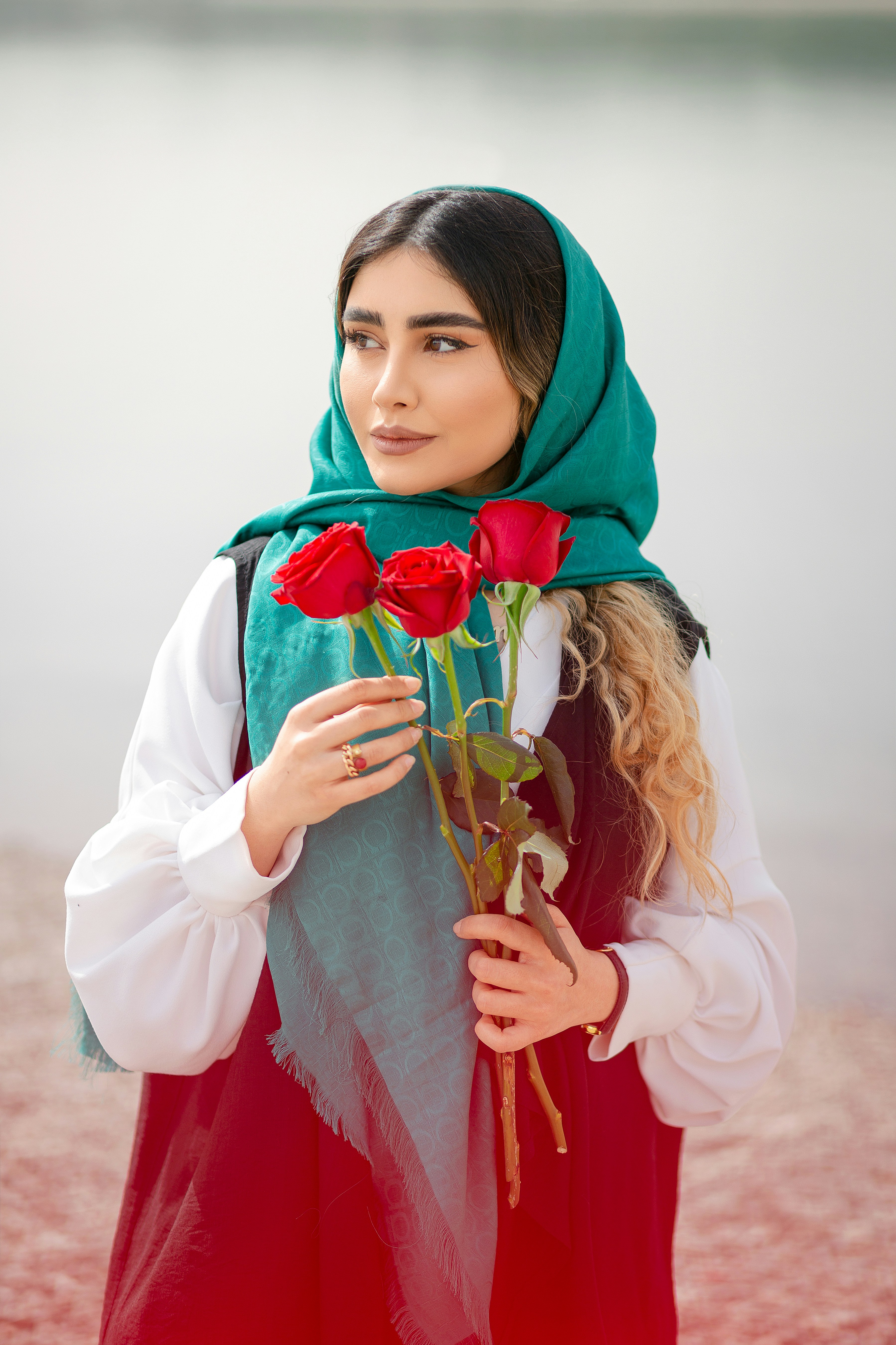 a person holding a bouquet of flowers