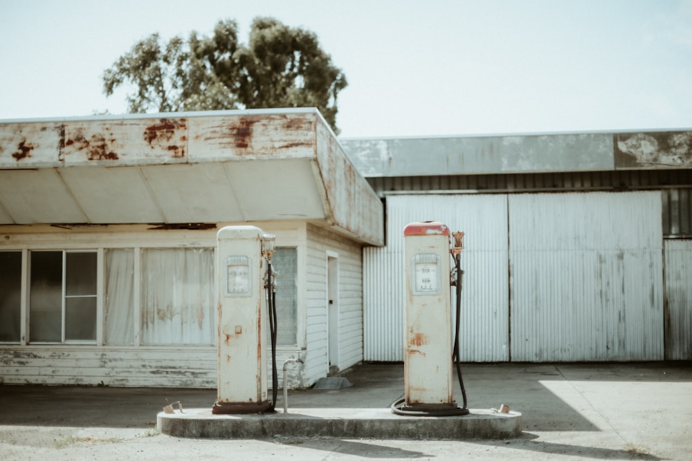 a few gas pumps outside a building