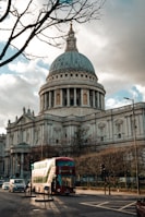 a double decker bus in front of a large building