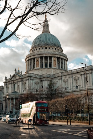 a double decker bus in front of a large building
