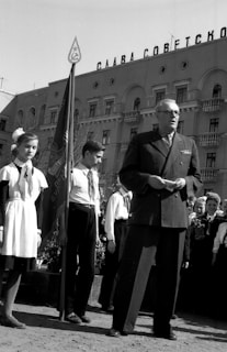 Black and white photo of a historic public announcement event.