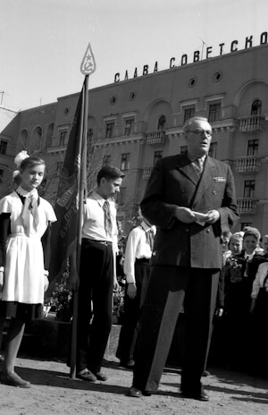 Black and white photo of a historic public announcement event.