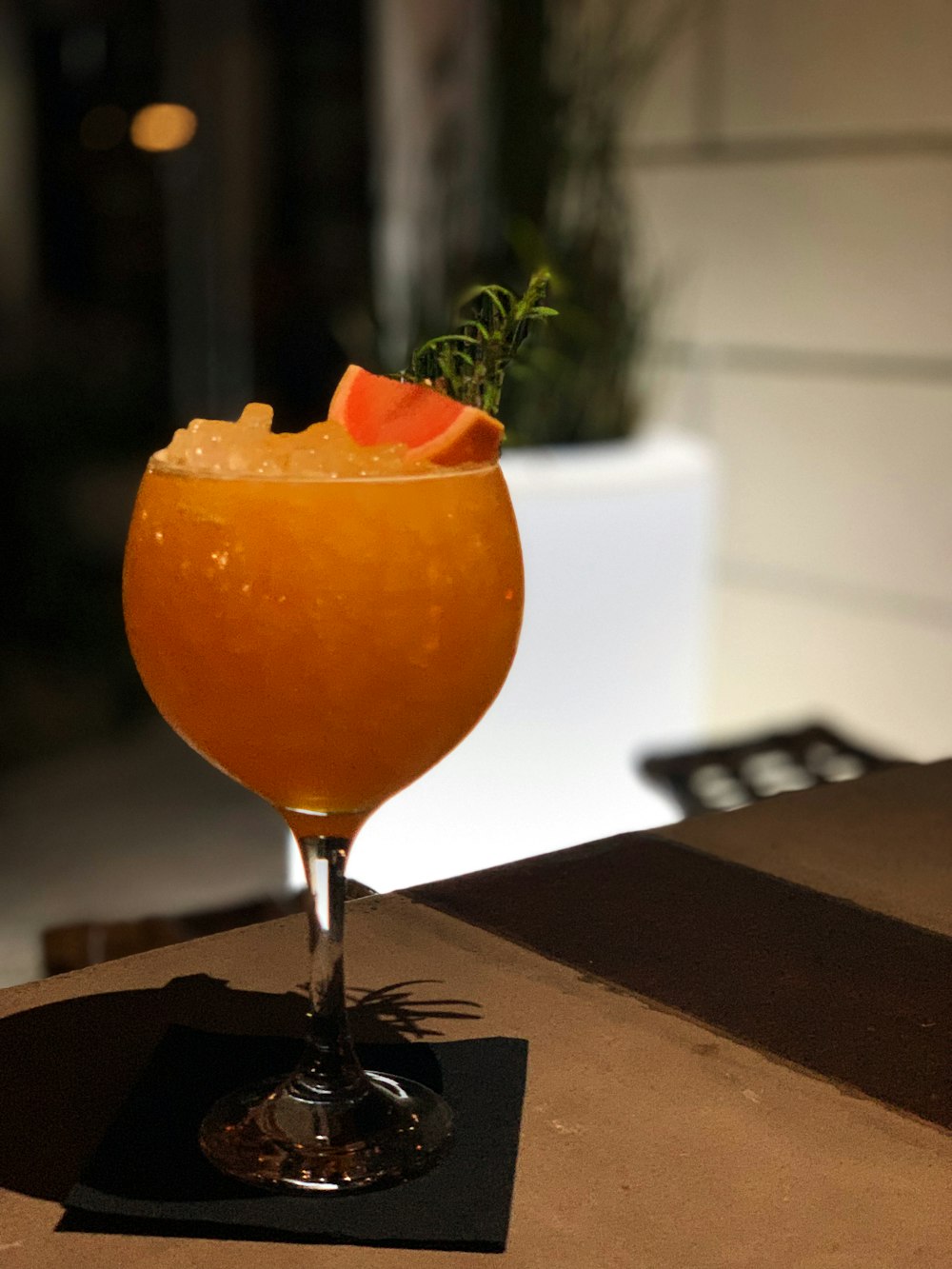 a glass of orange drink
